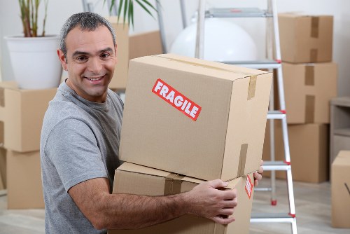 Removal van and moving boxes representing a home move in Kentish Town