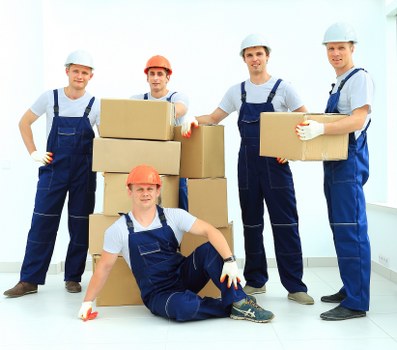 Careful loading of household items into a moving van