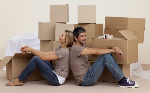 Professional movers handling boxes and furniture in Kentish Town