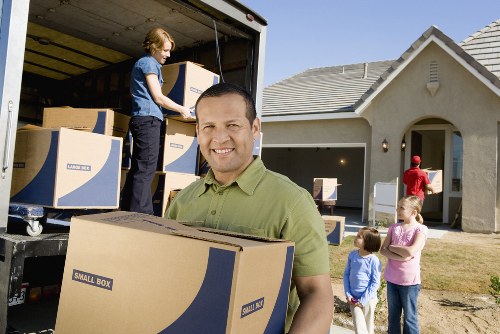 Packed office items and labelled cartons prepared for a local business relocation